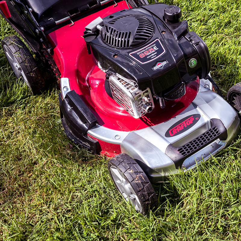 self propelled lawn mower vs push