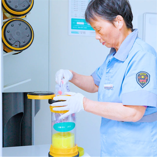 Improving Staff Coordination with Pneumatic Tube Networks in Hospitals