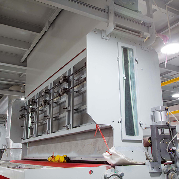 Factors influencing the price range of non woven fabric making machines in India.